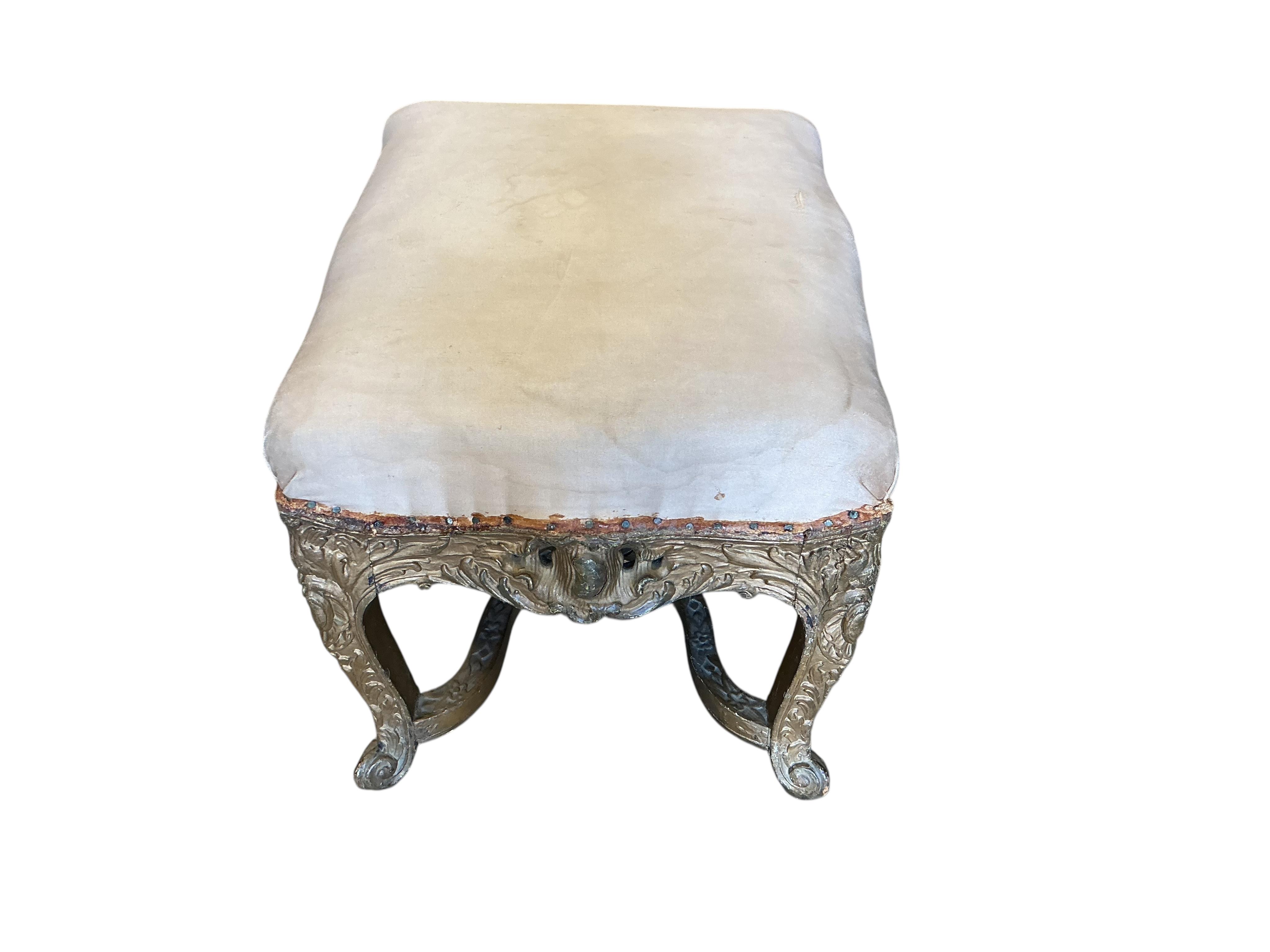 An 18th century carved giltwood stool, width 50cm, depth 40cm, height 40cm